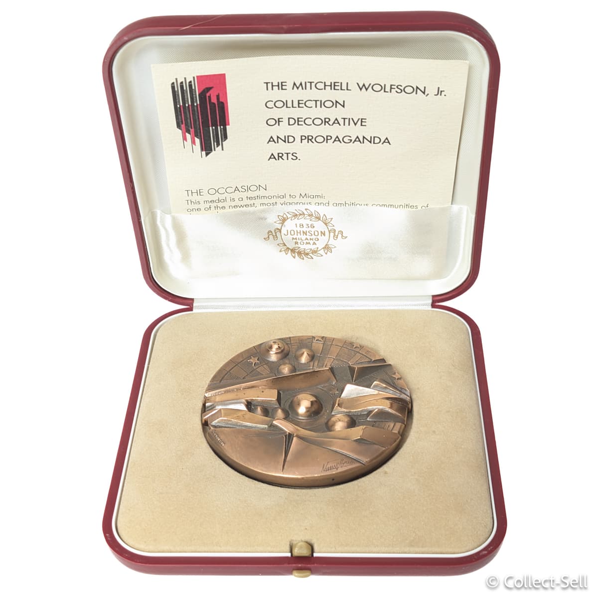 Bronze medal in red presentation case with booklet for the Mitchell Wolfson Jr. Collection of Decorative and Propaganda Arts, 1984